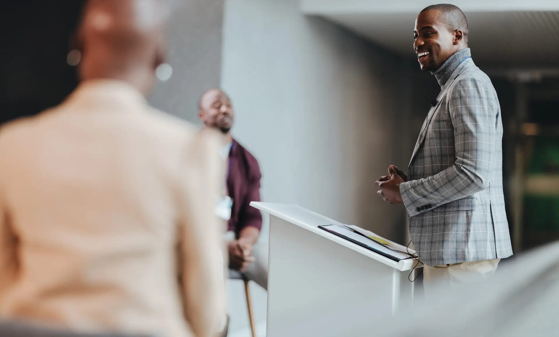 Black business owner giving speech at conference in Washington D.C.